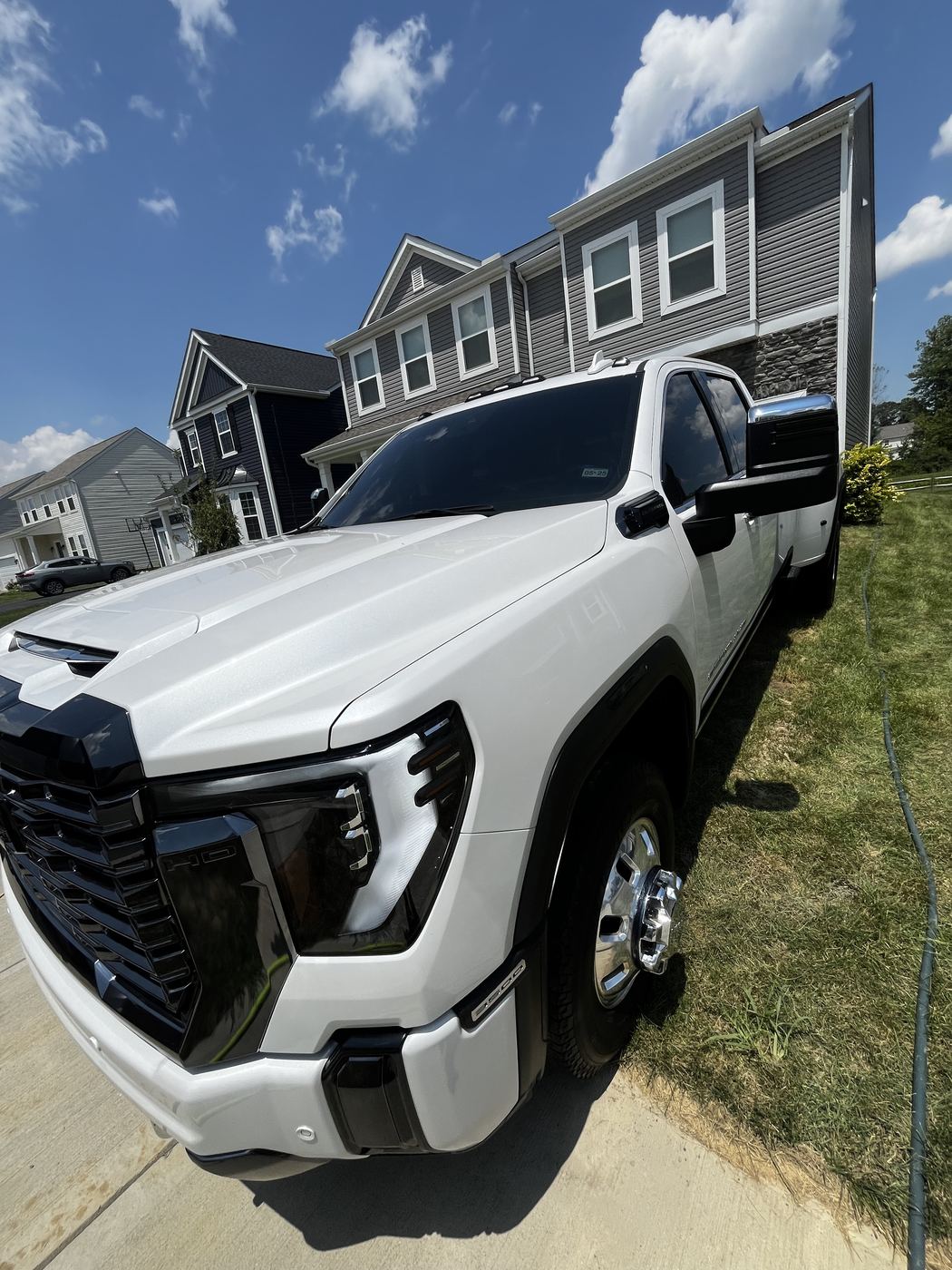 White GMC HD dually truck with ceramic-coated paint correction